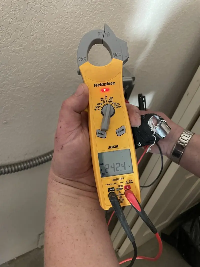 Voltage testing with clamp meter during Circuit Breaker Repair in Conley